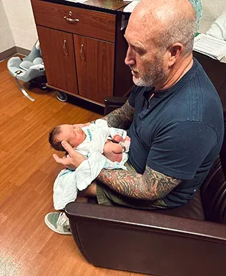 Chiropractor Edmond OK Vernon Millspaugh Infant Dr. Vernon Millspaugh adjusting an infant